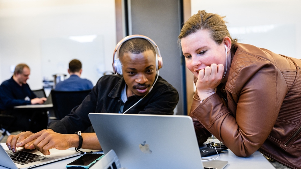 Staff and attendees collaborate at the annual ALCF Hackathon.